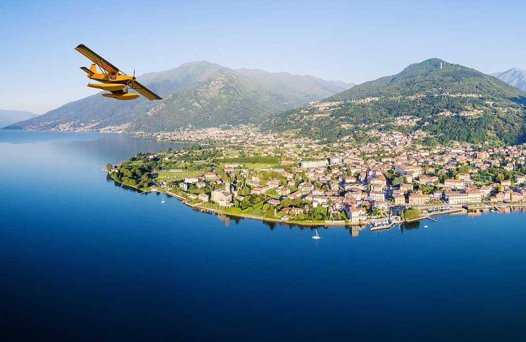 Seaplane flying over Lake Como in Italy.
