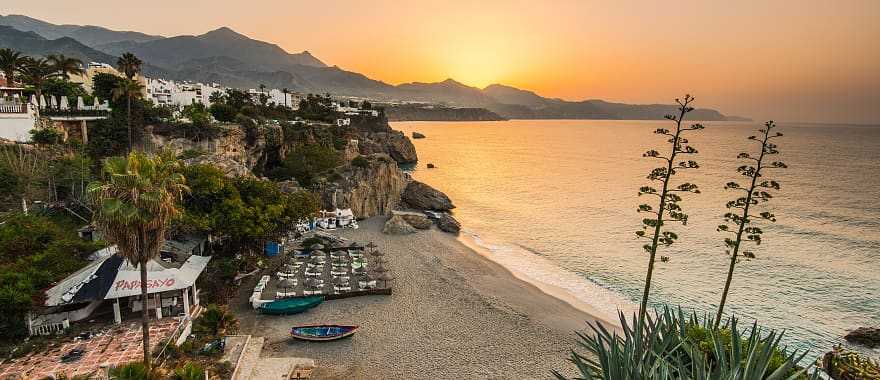 Romantic beach sunset in Nerja, Spain.