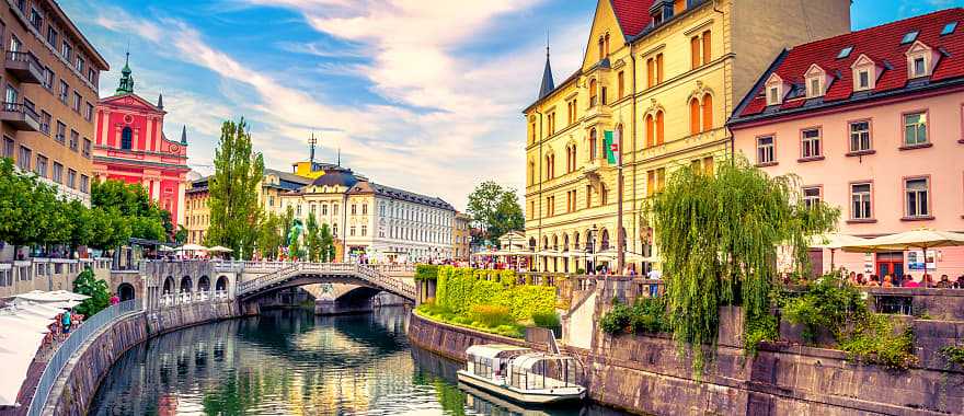 A canal weaving through old town Ljubljana.