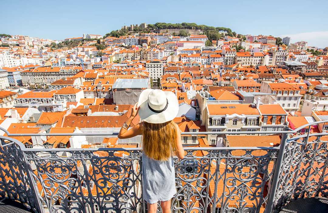 Lisbon, Portugal Female traveler at overlook in Lisbon, Portugal