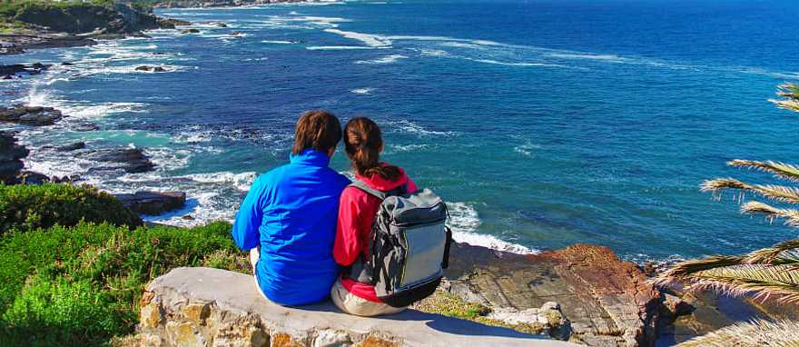 Old Harbor, Hermanus Happy couple looks at the beautiful view of the Old Harbor, Hermanus