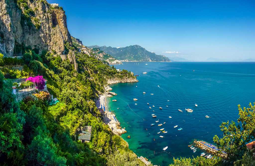 Italy's Amalfi Coast Postcard view of steep mountain cliffs and azure waters in the Amalfi Coast of Italy