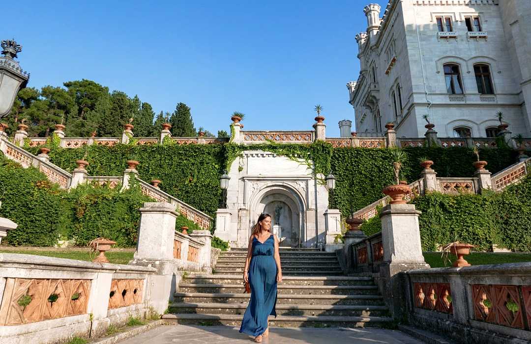 Castello di Miramare in Trieste, Italy Woman walking the grounds at Castello di Miramare in Trieste, Italy
