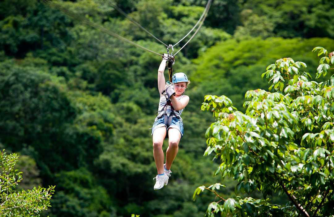 Young girl ziplining in Costa Rica