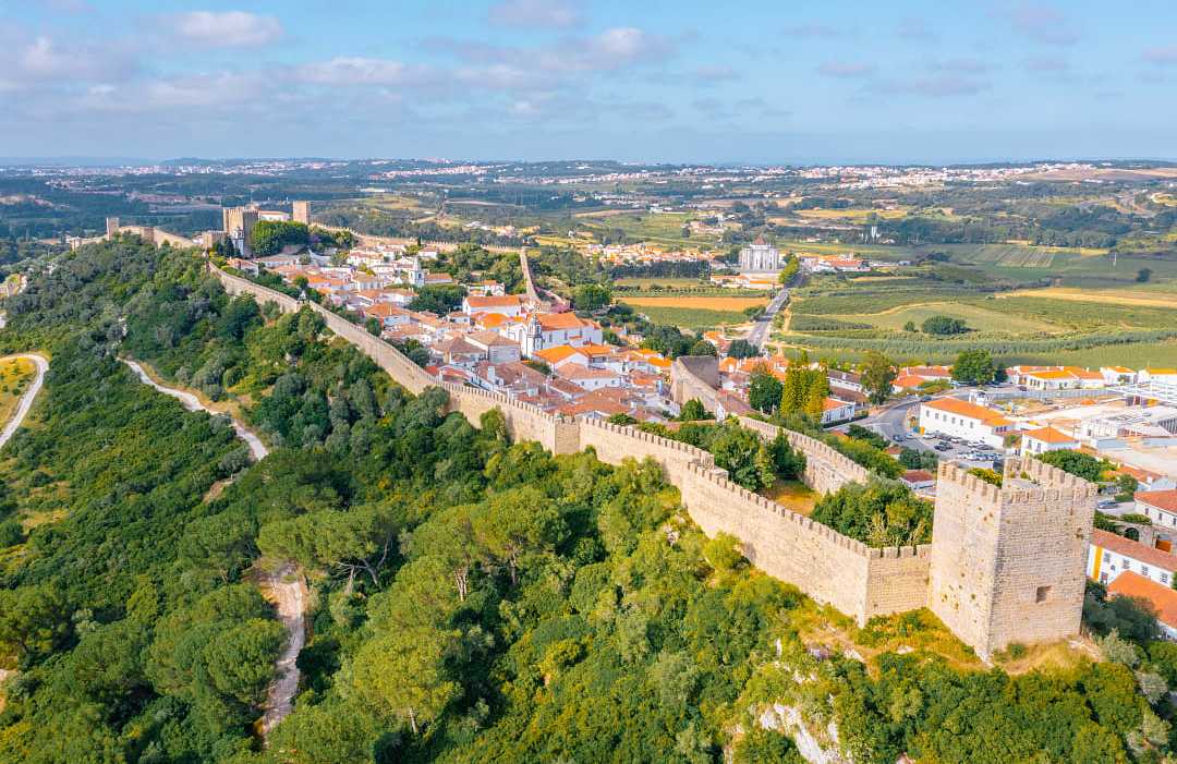 Panorama of the hilltop town of Obidos surrounded by medieval wall
