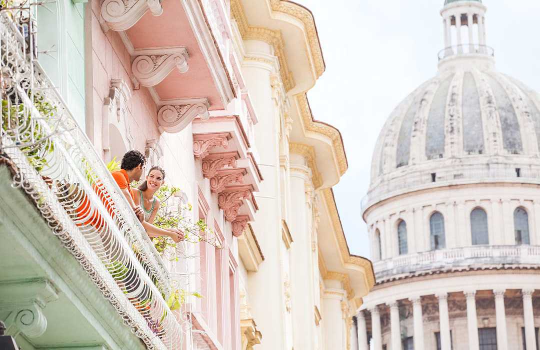 Couple on a balcony in Havana, Cuba