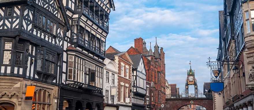 Half-timbered buildings with the Eastgate and Eastgate Clock in the old city of Chester, England