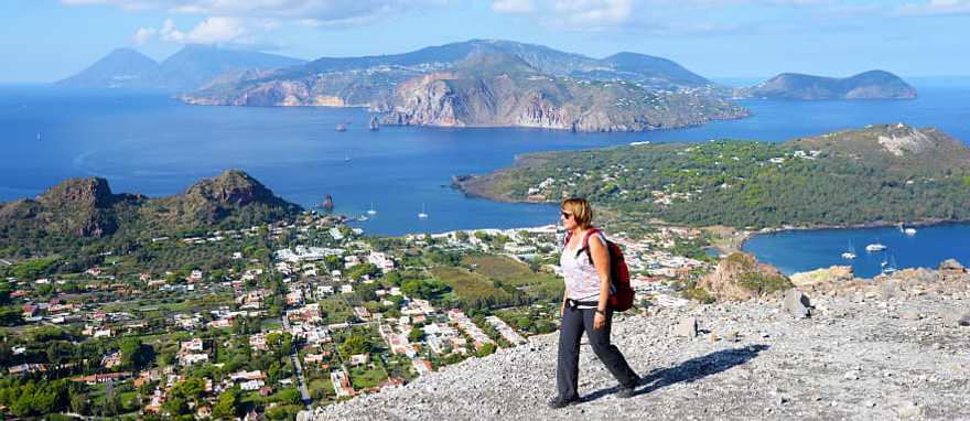 Woman hiking on the Gran Crater on Vulcano, on of seven Aeolian Island in Sicily, Italy Woman hiking on the Gran Crater on Vulcano, on of seven Aeolian Island in Sicily, Italy