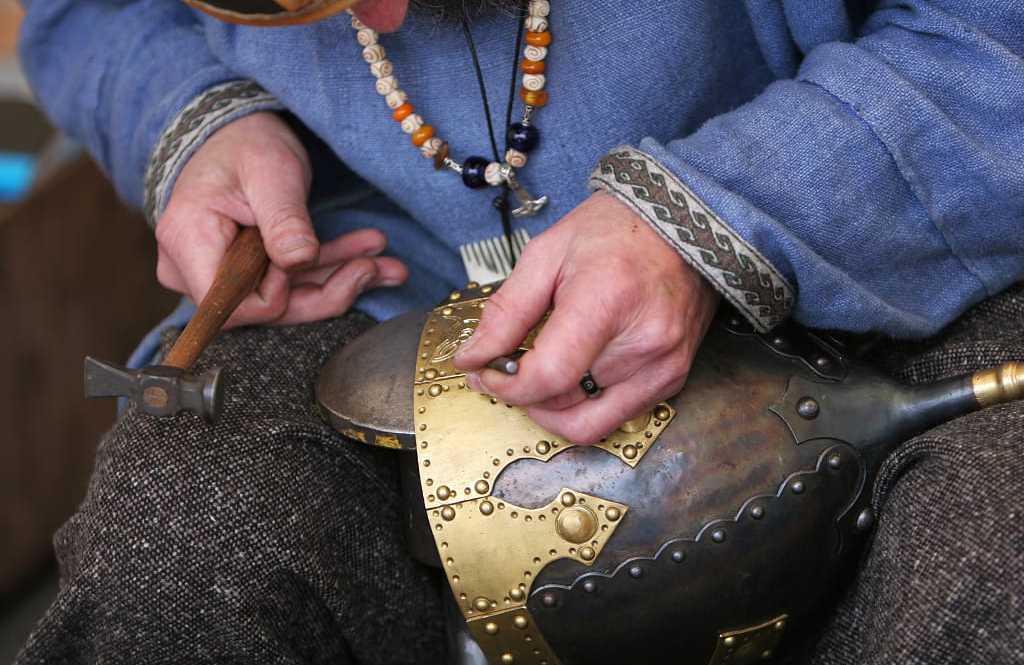 metal craftsman making a medieval soldiers helmet armor the old fashioned way metal craftsman making a medieval soldiers helmet armor the old fashioned way