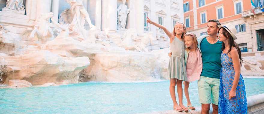 Family at at Trevi Fountain in Rome, Italy Family at at Trevi Fountain in Rome, Italy