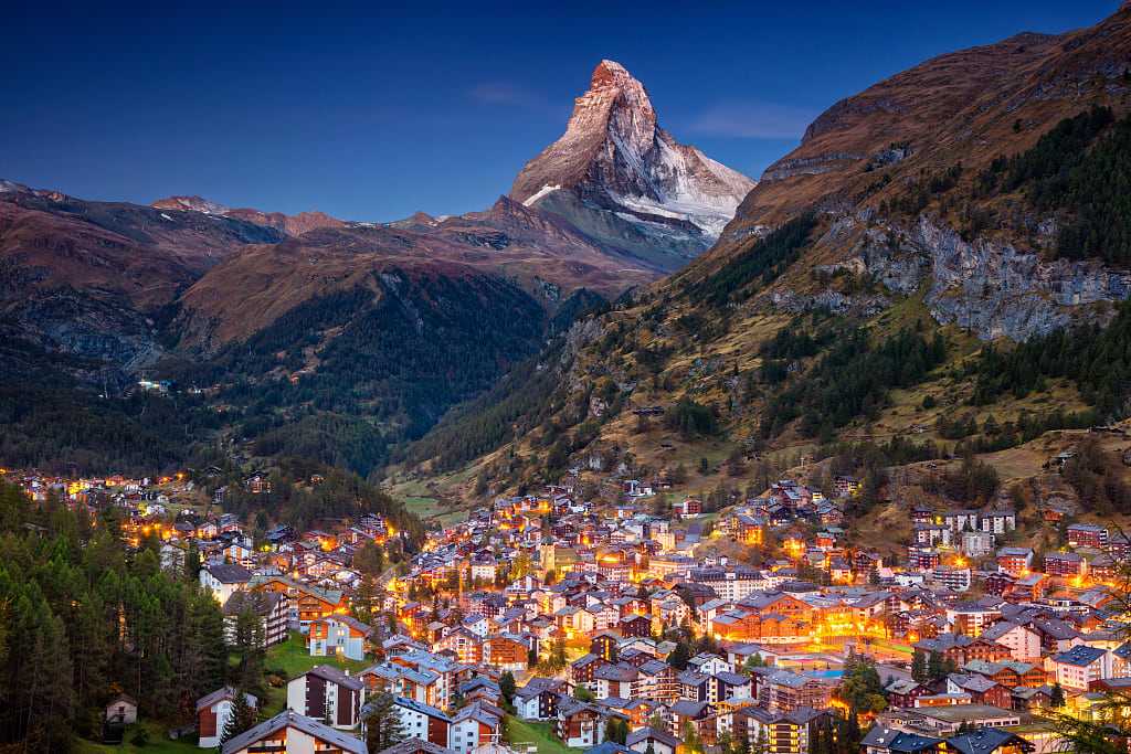 village of Zermatt, Switzerland with Matterhorn in the background during twilight in Switzerland