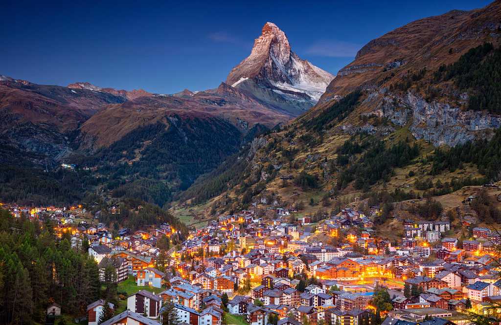village of Zermatt, Switzerland with Matterhorn in the background during twilight in Switzerland