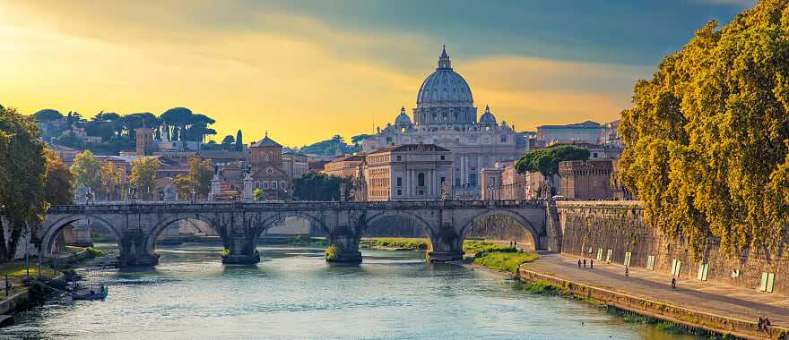 Boat sailing on Tiber River with Saint Peter's Basilica in Rome, Italy