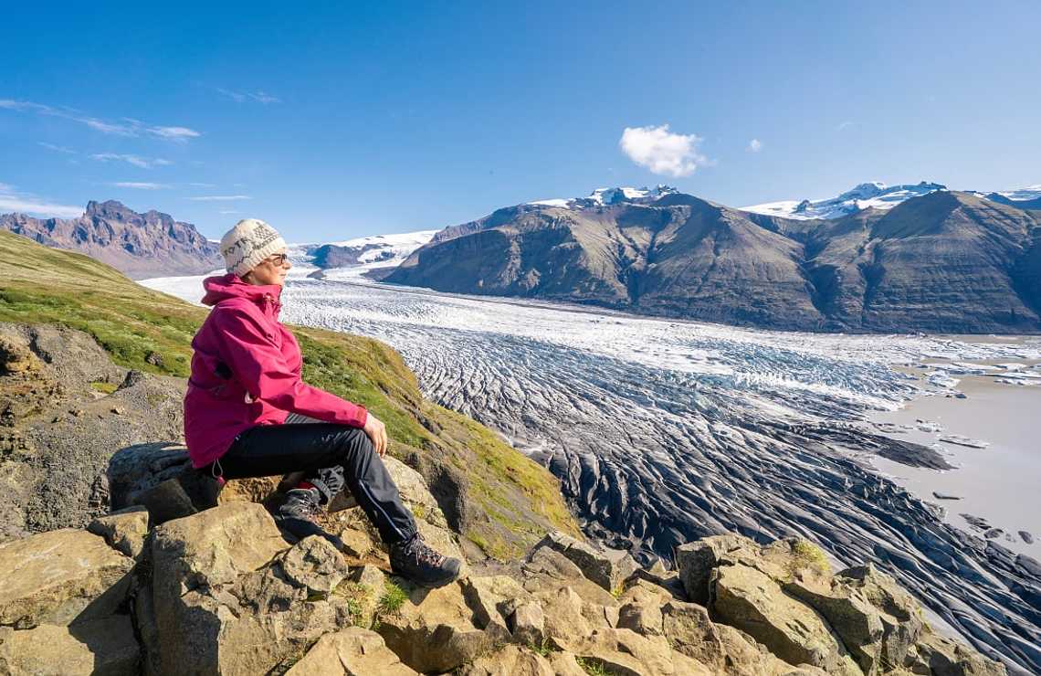 Senior woman overlooking Vatnajokull Glacier in Iceland
