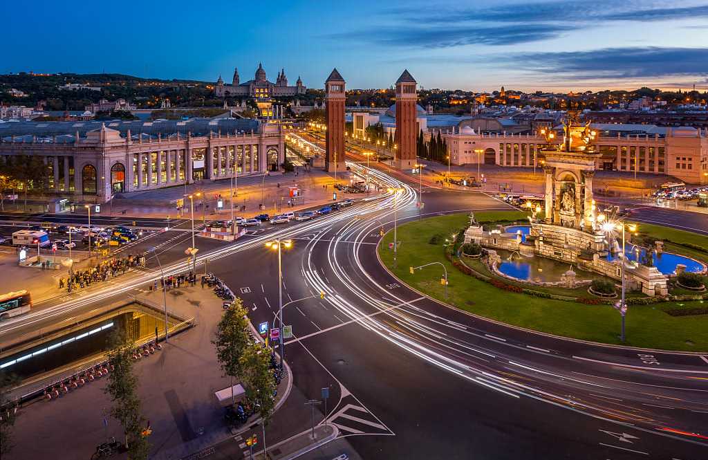 Traffic circling Placa d'Espanya in Barcelona, Spain.