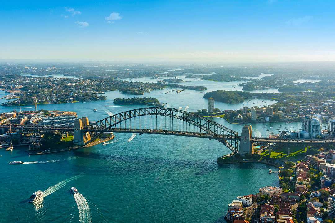 Australia’s iconic Harbour Bridge in Sydney showcases the vibrant city.