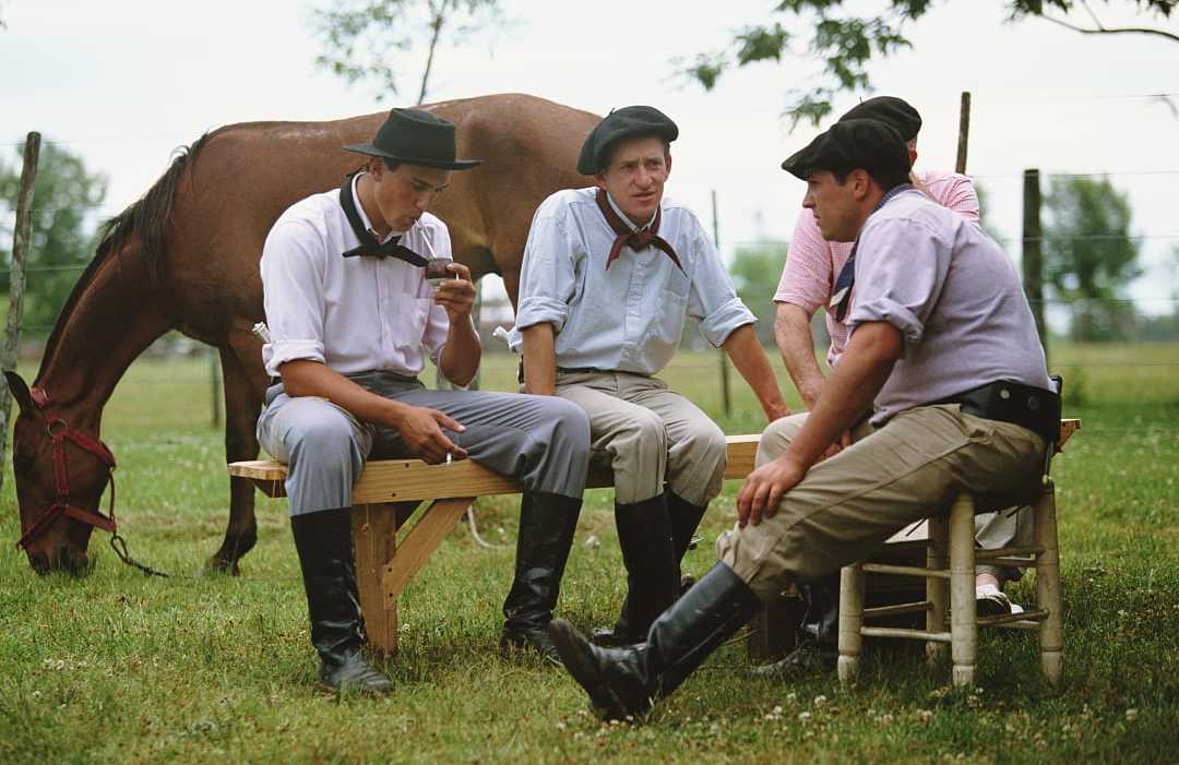 Argentinian Gauchos drinking mate. Argentinian Gauchos drinking mate.