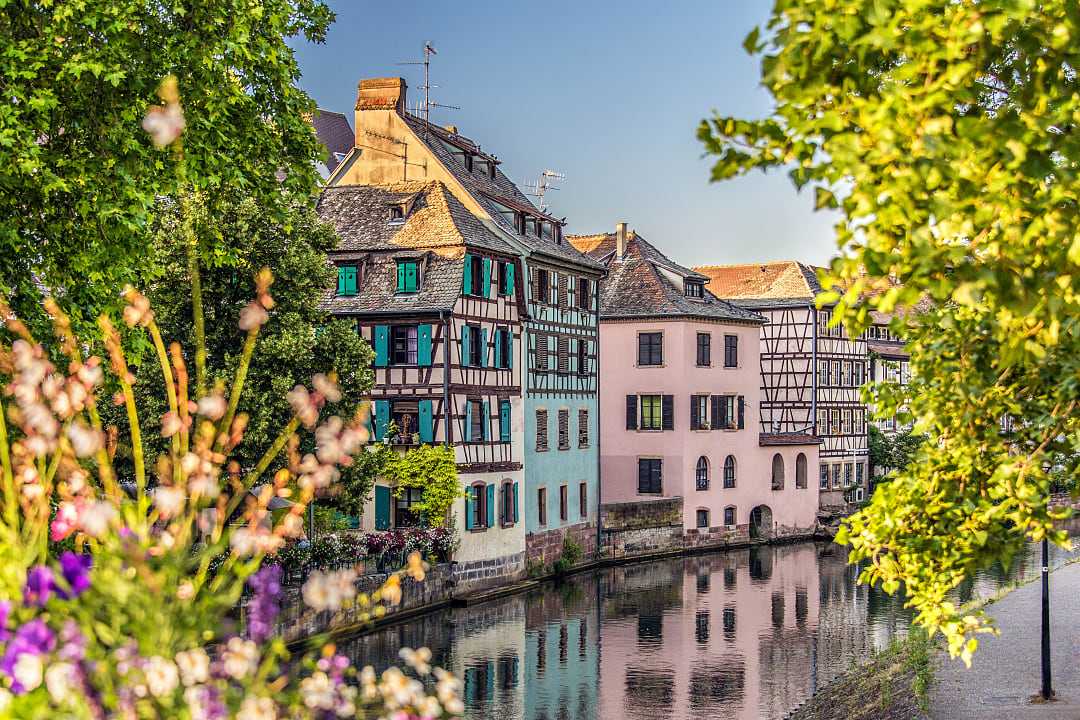 Colorful half-timbered houses along a canal in Strasbourg's Petite France district