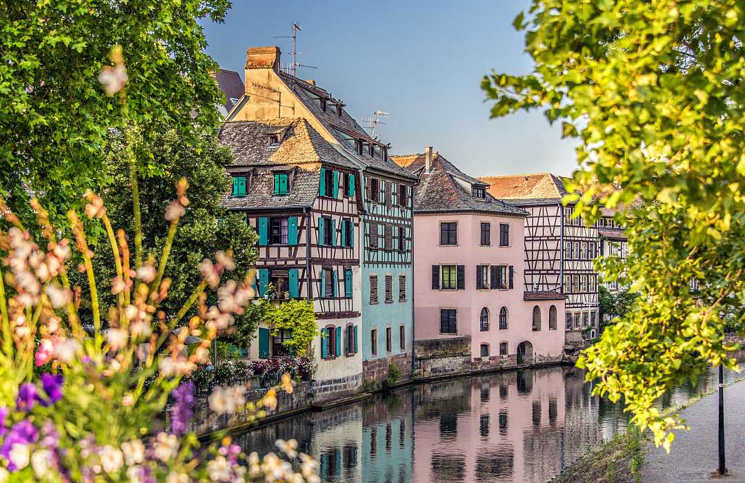 Colorful half-timbered houses along a canal in Strasbourg's Petite France district