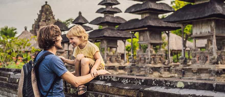 Dad and son tourists in traditional Balinese hindu temple