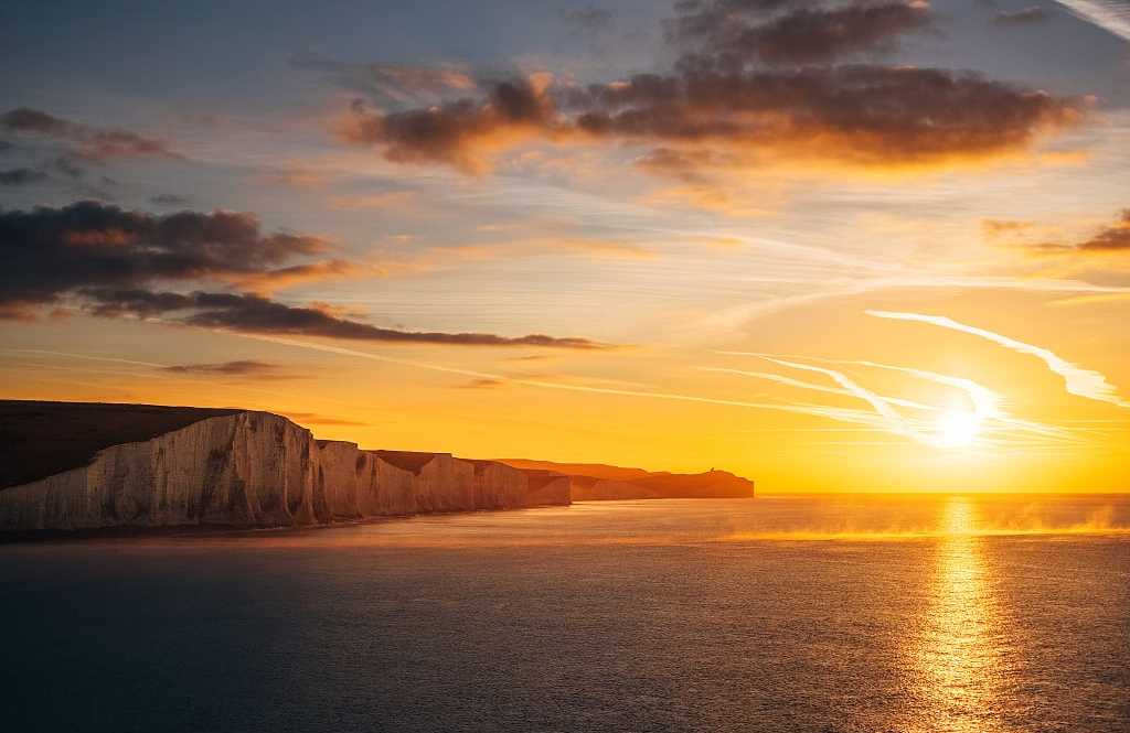Sunrise over Seven Sisters chalk cliffs in East Sussex, England