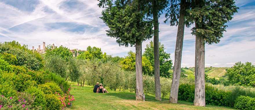 Couple relaxing and enjoying the view of the Tuscany countryside in Italy