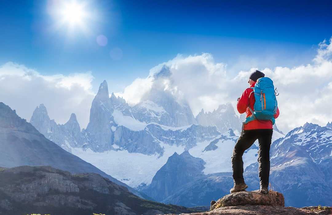 Hiker stopping to admire Mount Fitz Roy in Patagonia