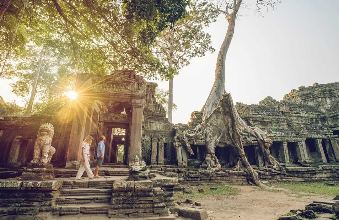 Couple exploring Angkor Wat in Siem Reap, Cambodia
