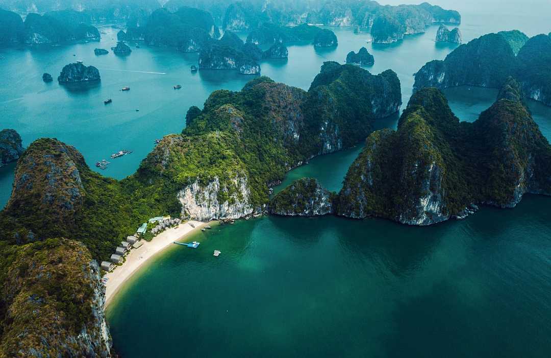 Stretch of beach on an island in Ha Long Bay, Vietnam