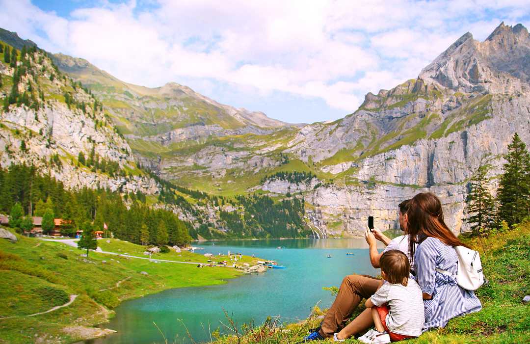 Family photographing nature in Switzerland