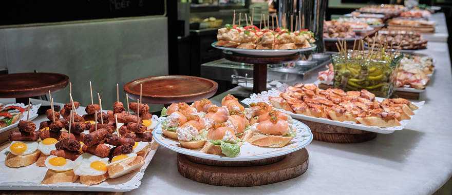 Spanish tapas, or pintxos, on the counter at a bar in San Sebastian, Spain