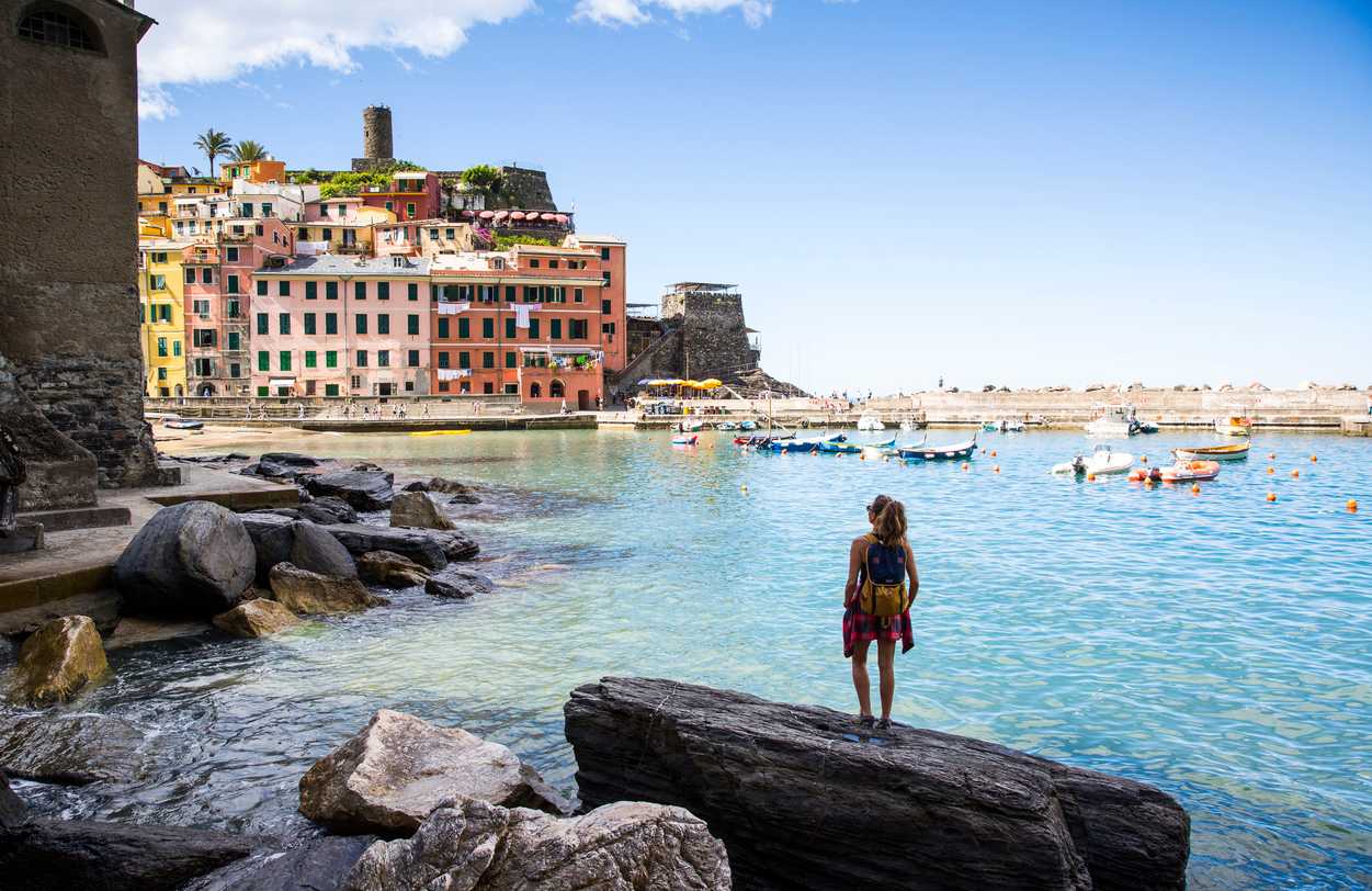 Woman looking out to sea in Vernazza, Cinque Terre.