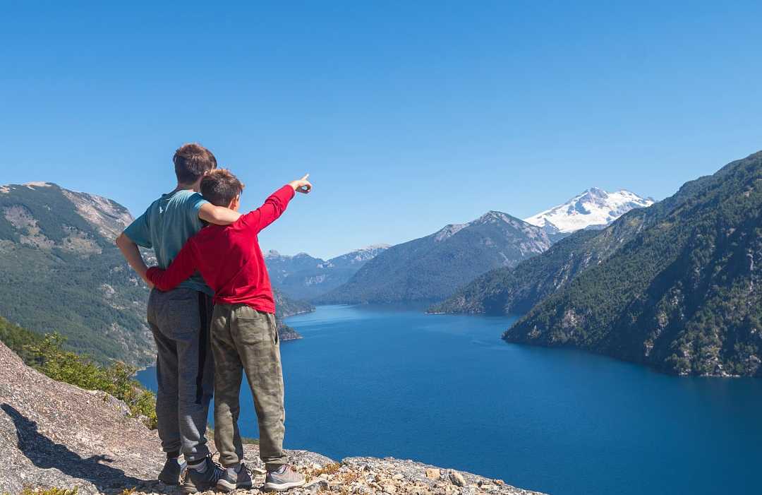 Bariloche, Argentina Kids enjoying the view of lake and mountains in Bariloche, Argentina