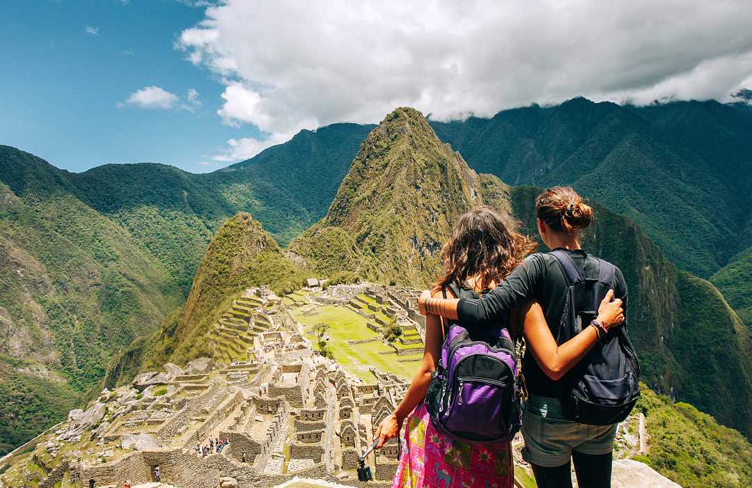 Machu Picchu, Peru Couple at the gret Inca city of Machu Picchu in Peru