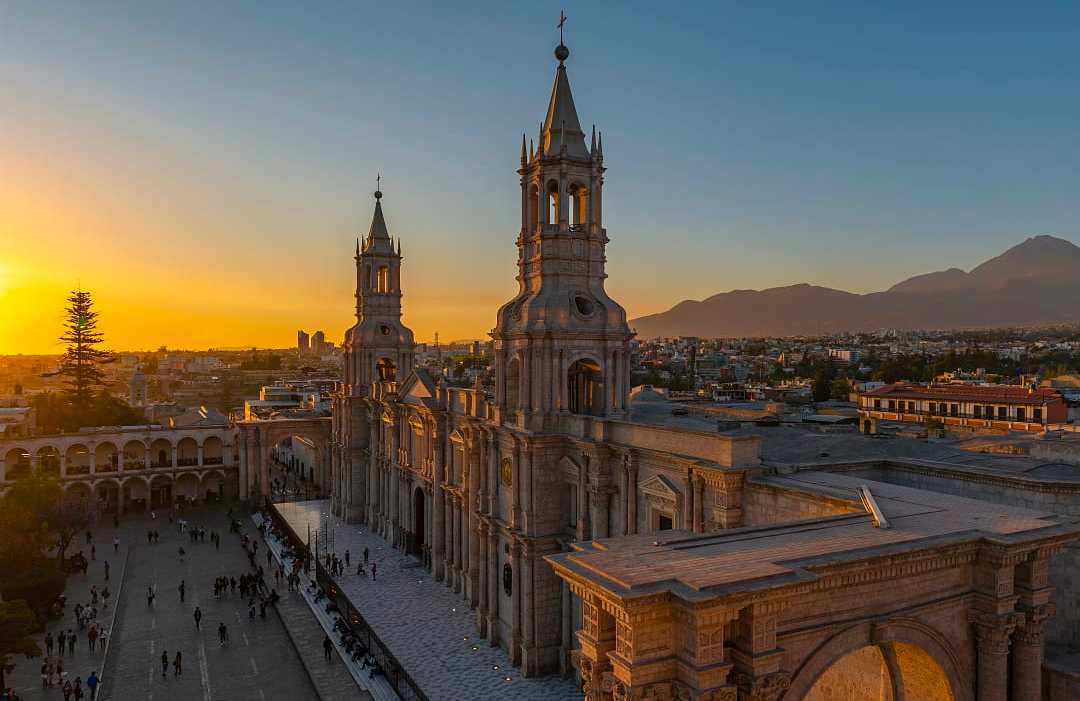 Arequipa, Peru Arequipa Cathedral at sunset, historic landmark in Peru with volcanic mountains in the background