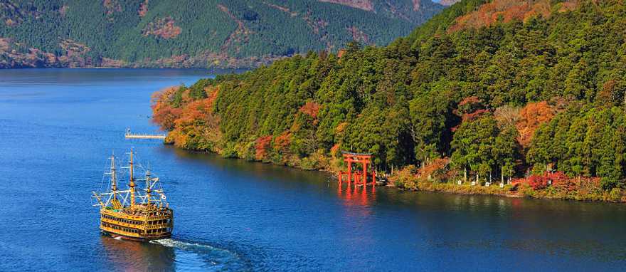 Mt Fuji and Lake Ashi with sightseeing pirate ship in Hakone National Park, Japan.