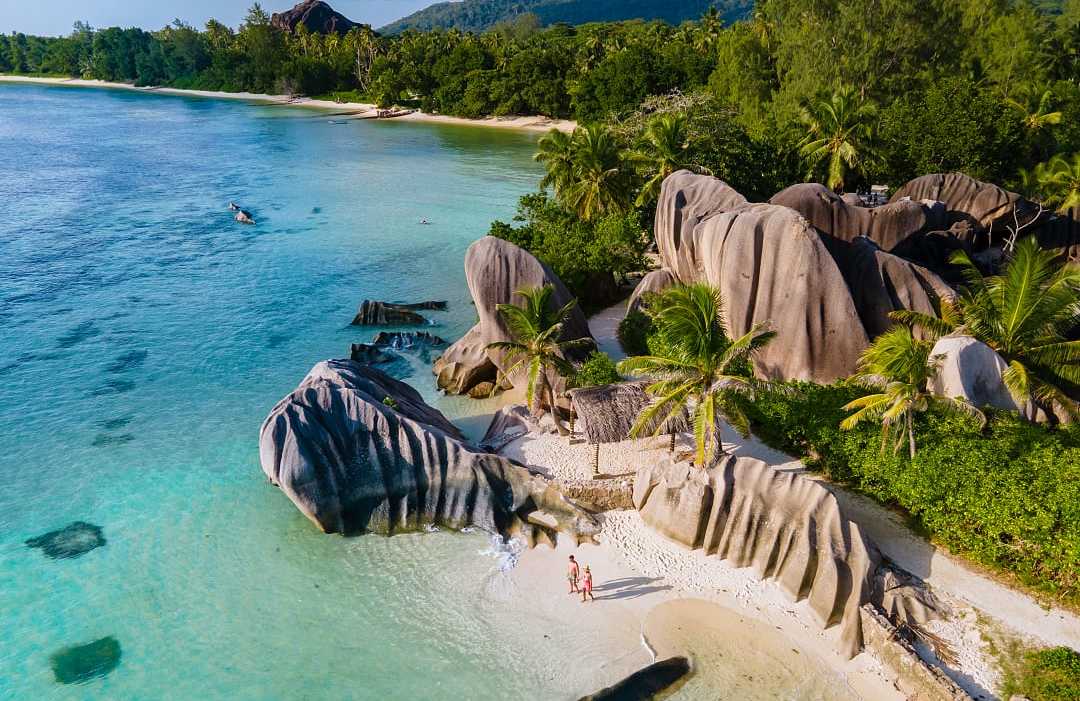 Couple at Anse Source d'Argent Beach on La Digue Island, Seychelles