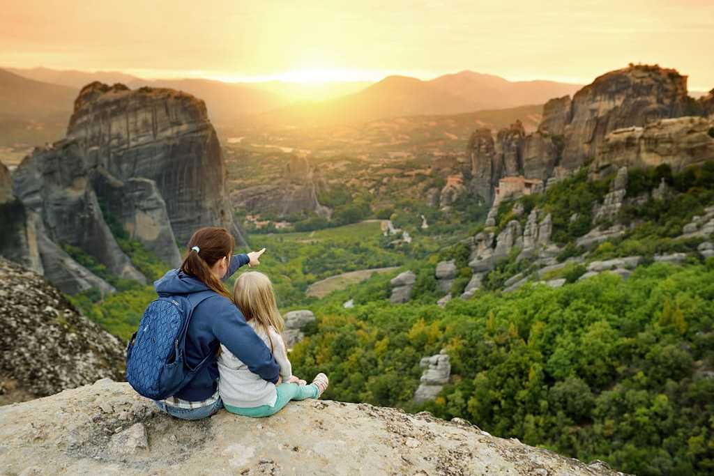 Mother and daughter exploring Meteora valley in Greece