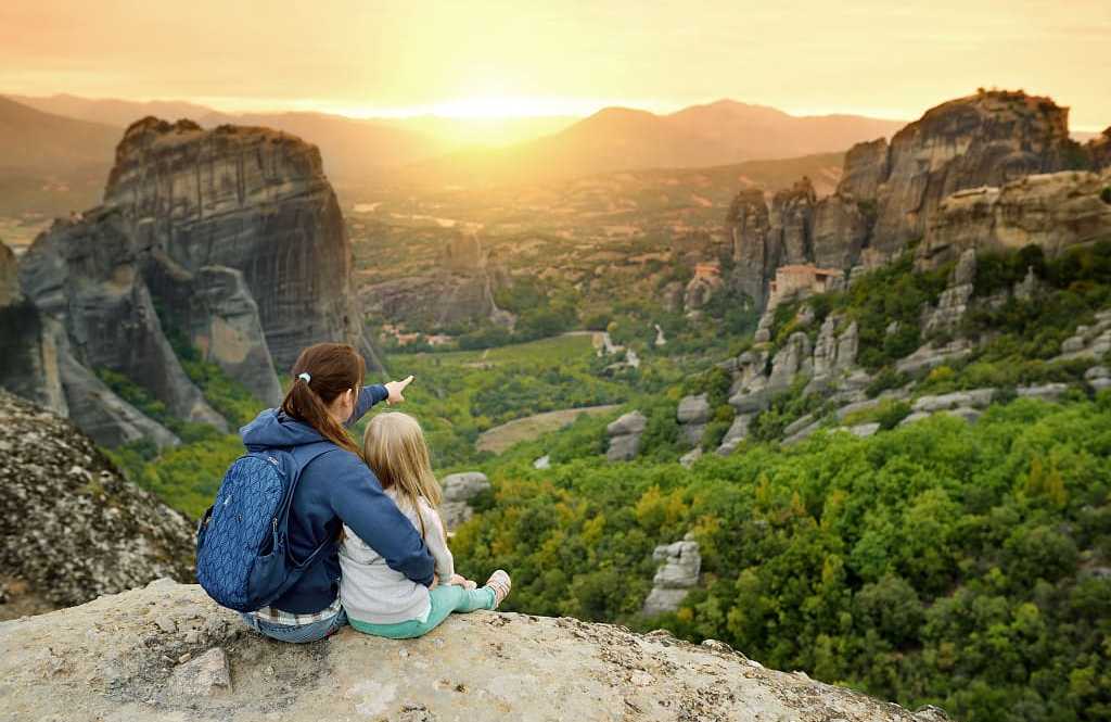 Mother and daughter exploring Meteora valley in Greece