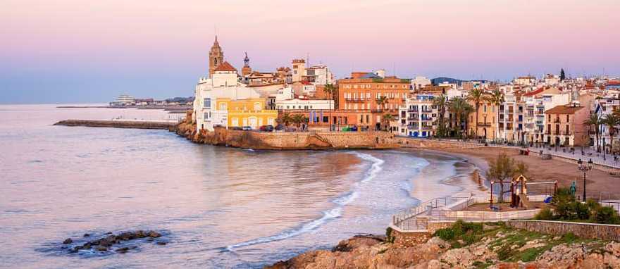 Sand beach and historical Old Town in mediterranean resort Sitges, Spain