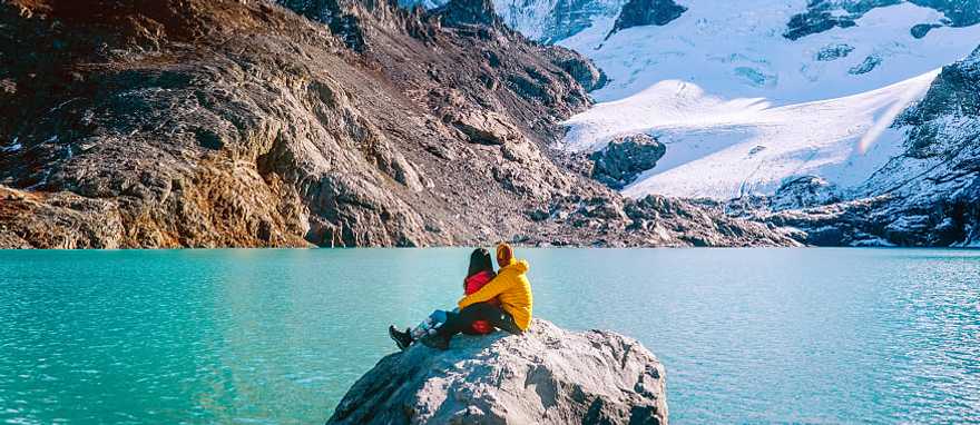 Couple admiring mount Fitzroy in the Argentinian Patagonia