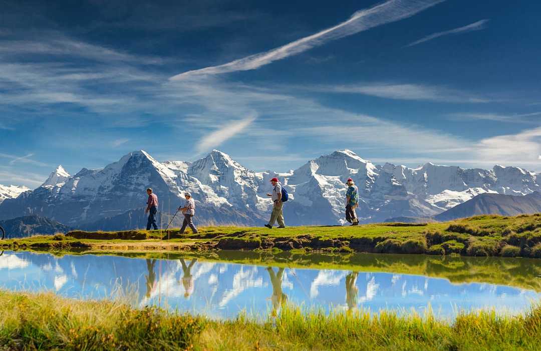 Seniors hiking in the Swiss Alps