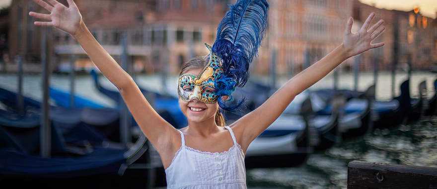 Young girl wearing carnival mask in Venice, Italy