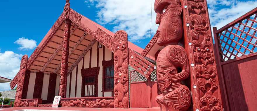 Maori carving and meeting house in Rotorua, New Zealand Maori carving and meeting house in Rotorua, New Zealand
