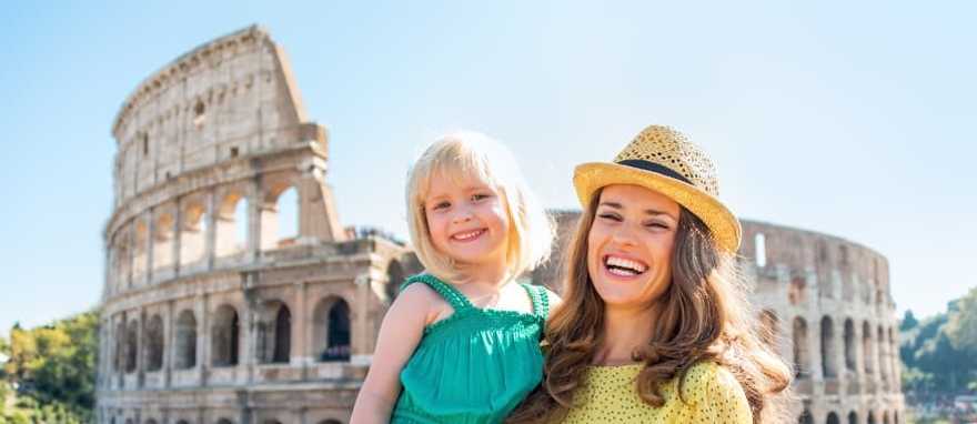 Mother and daughter in front of the Colosseum in Rome, Italy.