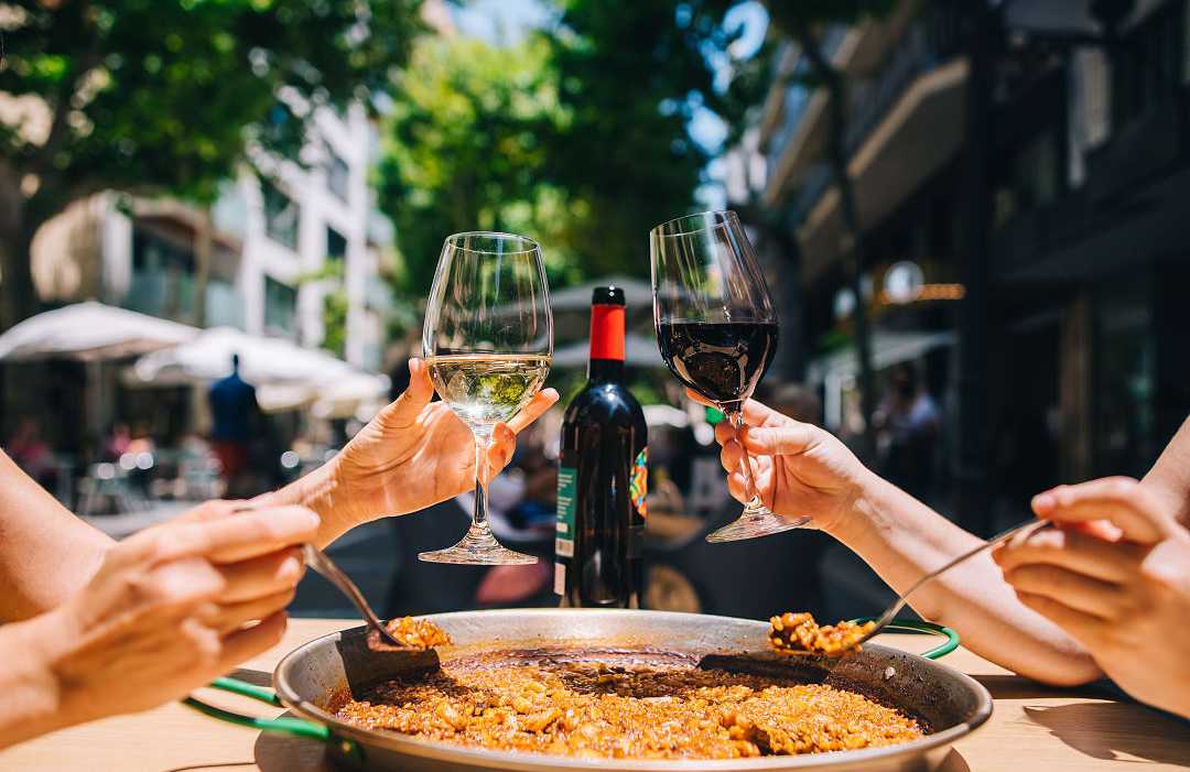 Spanish paella and wine served at a restaurant