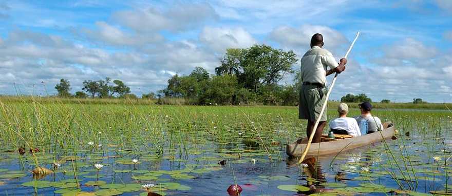 Mokoro ride on the Okavango Delta River in Botswana Mokoro ride on the Okavango Delta River in Botswana