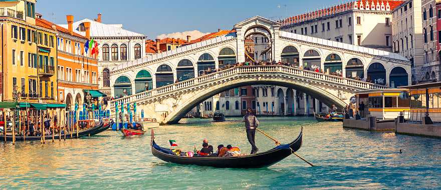 Gondola ride near the Rialto Bridge on the Grand Canal in Venice, Italy