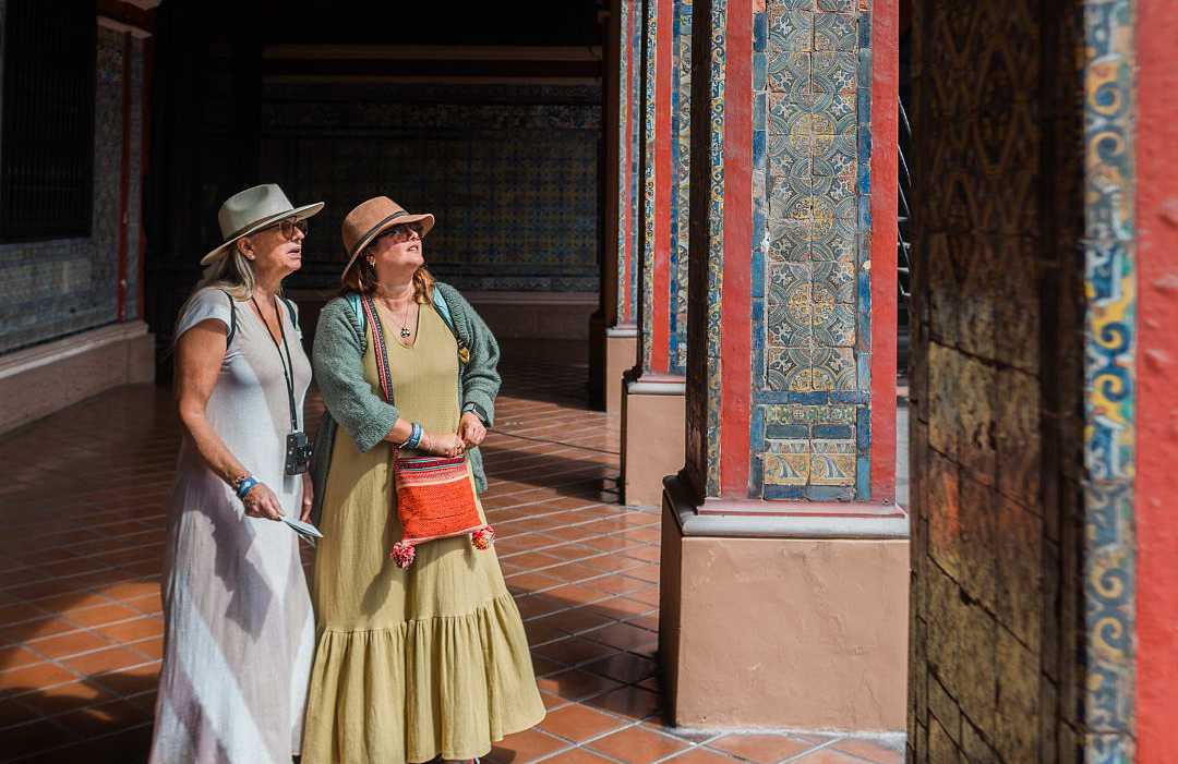 Lima, Peru Senior travelers exploring the colorful tile work of the Convent of Santo Domingo in Lima, Peru